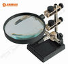 Helping hand with magnifier