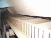 Raised edge conveyor belt