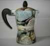 coffee maker with rock painting finished