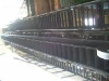 Raised edge conveyor belt