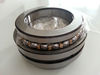 Double direction thrust angular contact bearing