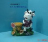 Polyresin figurine with ceramic pot